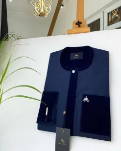 A Navy blue senator with a velvet flap pocket and cuff detail African Kaftan