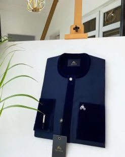 A Navy blue senator with a velvet flap pocket and cuff detail African Kaftan