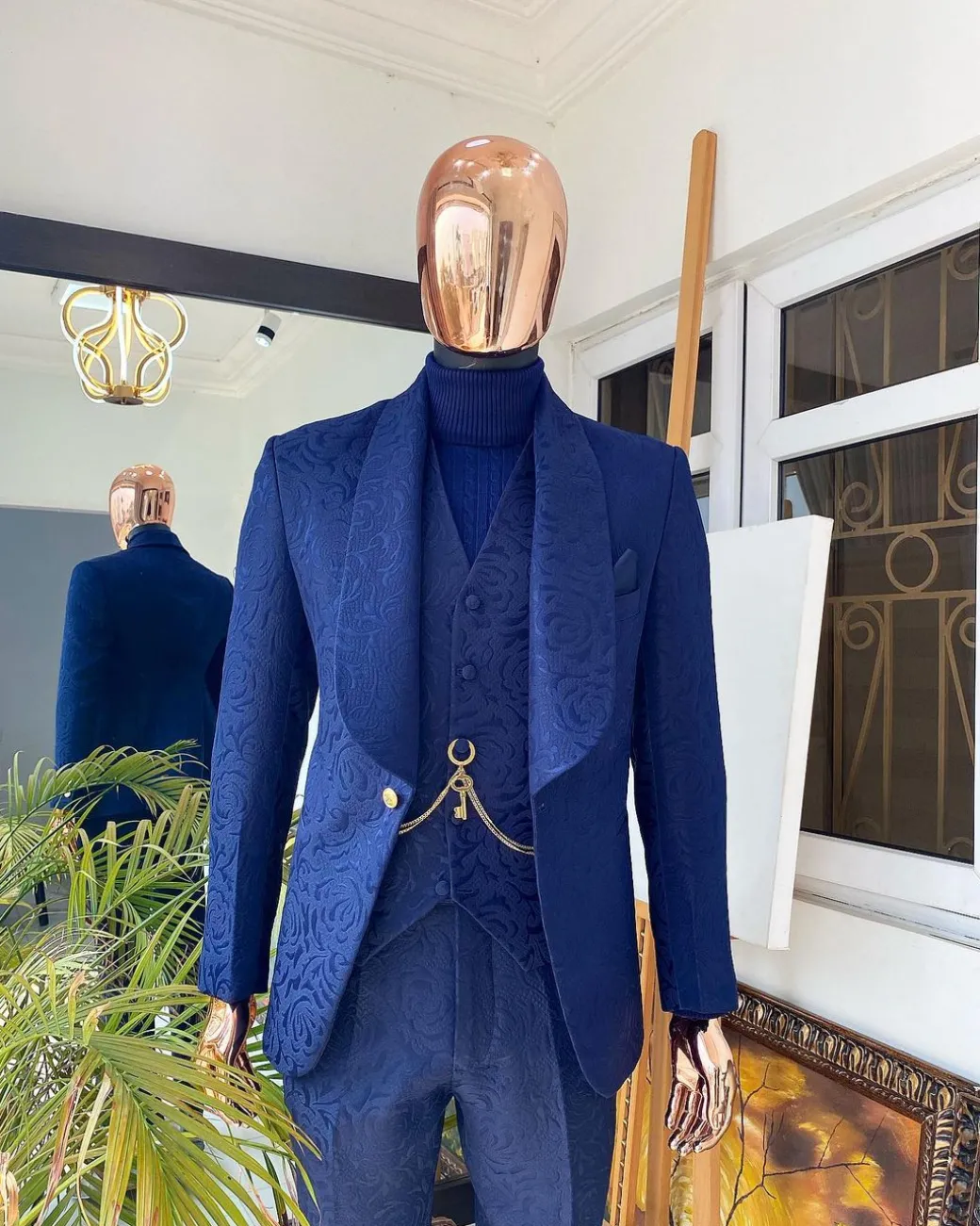 A Navy blue shawl lapel floral pattern jacquard tuxedo suit