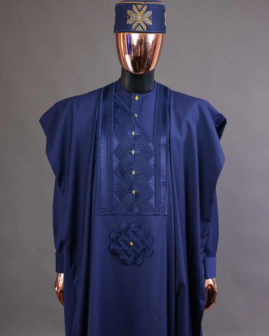 A Navy Blue, Slanting Cube With Dotted Gold Detailing Agbada