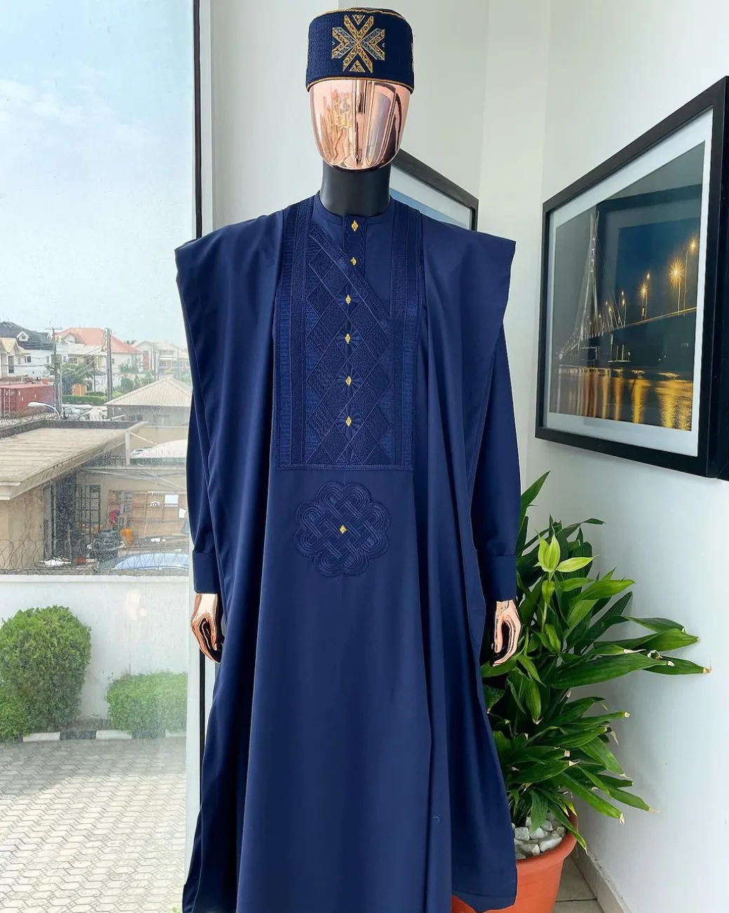 A Navy Blue, Slanting Cube With Dotted Gold Detailing Agbada