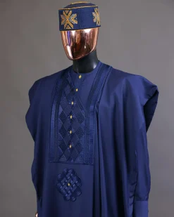 A Navy Blue, Slanting Cube With Dotted Gold Detailing Agbada