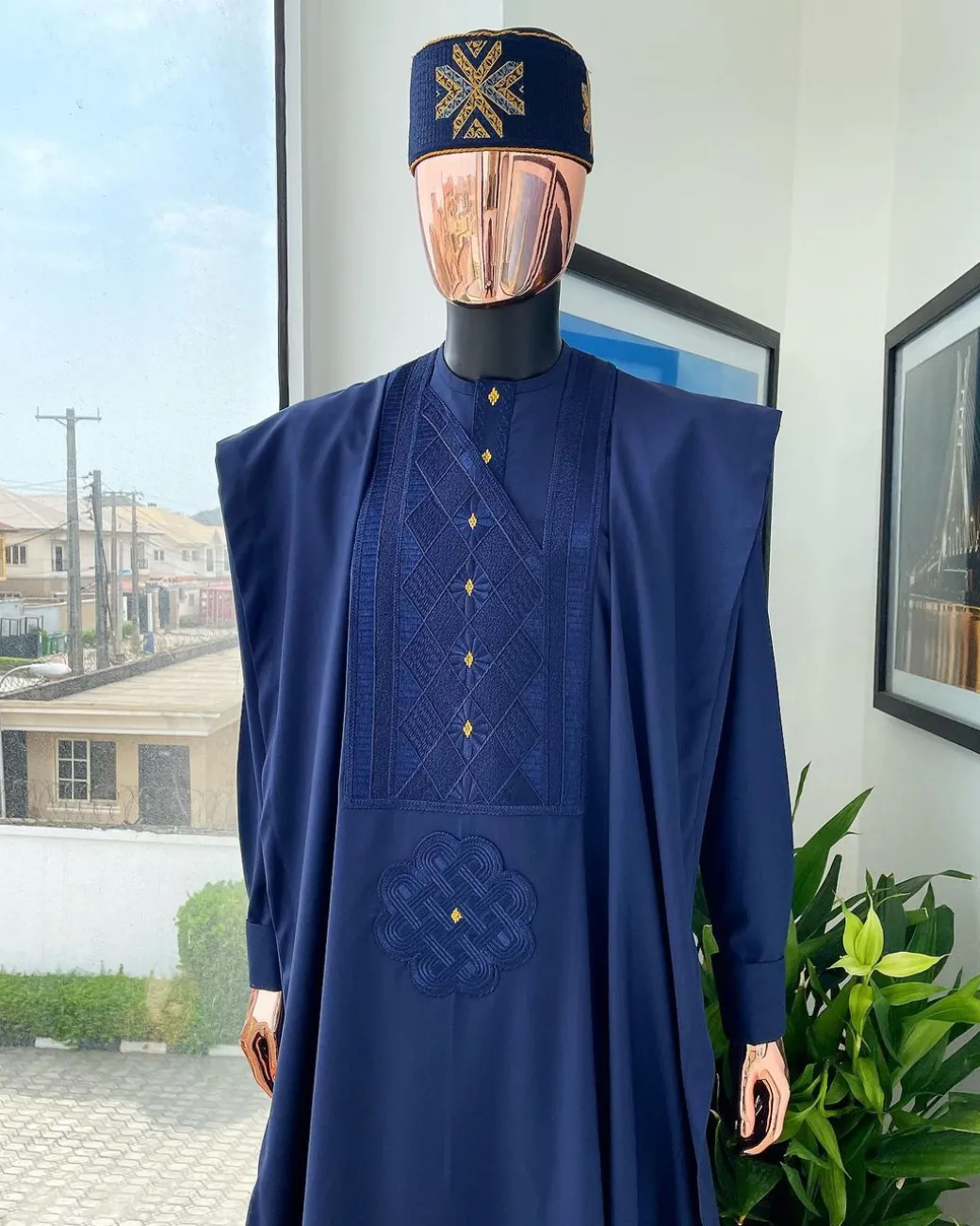 A Navy Blue, Slanting Cube With Dotted Gold Detailing Agbada