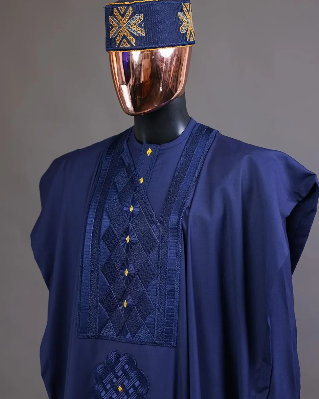 A Navy Blue, Slanting Cube With Dotted Gold Detailing Agbada