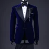 A Navy blue, soaked velvet peak lapel tuxedo suit
