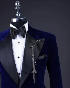 A Navy blue, soaked velvet peak lapel tuxedo suit