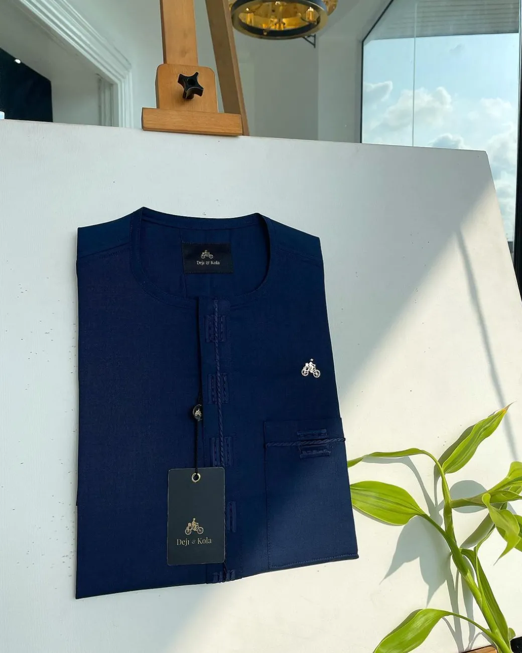 A Navy blue, straight and box connecting lane embroidery detailing african traditional senator kaftan native.