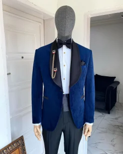 A Navy Blue Velvet Dinner Shawl Lapel Tuxedo Suit.