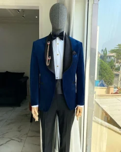 A Navy Blue Velvet Dinner Shawl Lapel Tuxedo Suit.