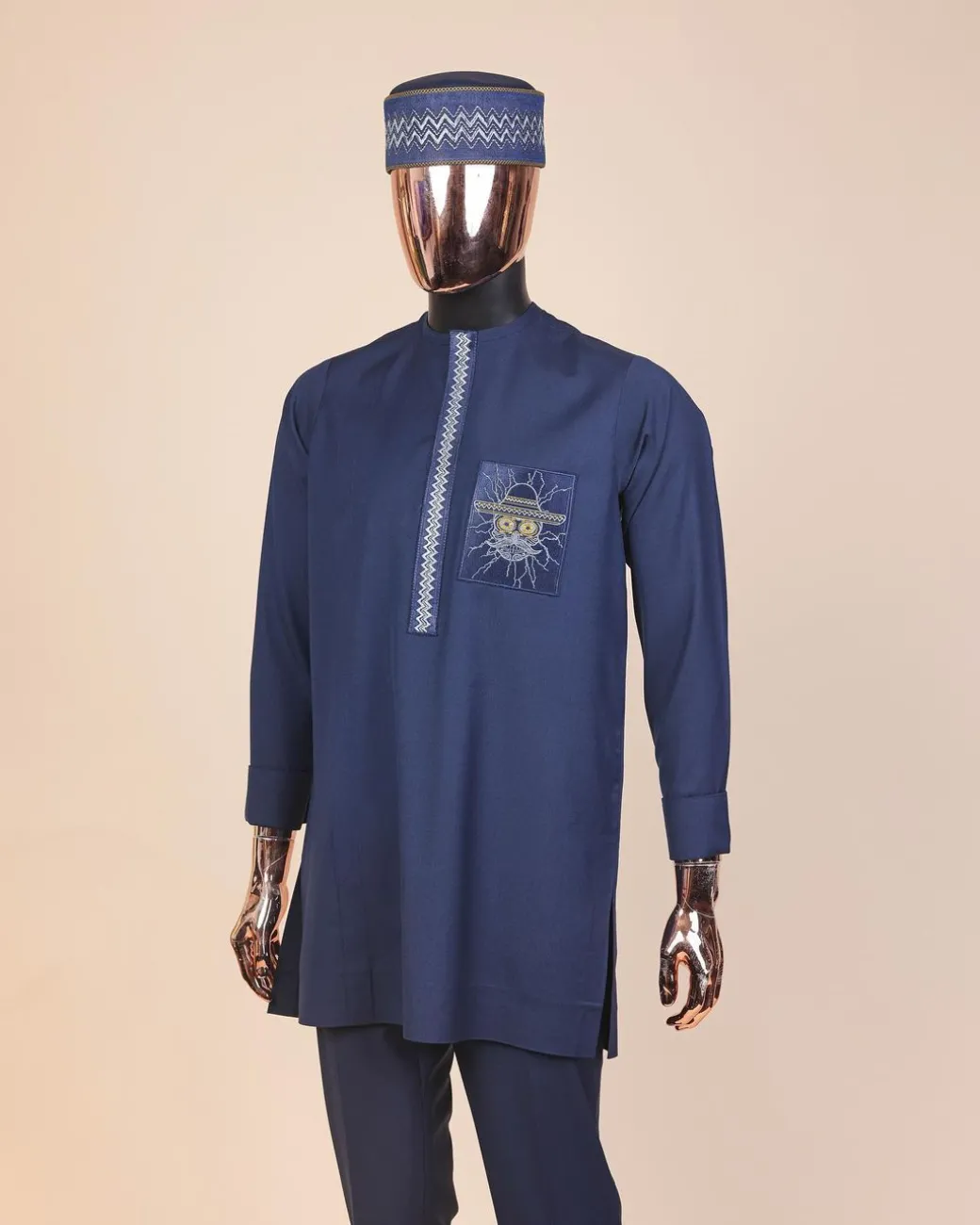 A Navy blue, vexing demagogue pocket and flap embrodery, long sleeve African senator kaftan native.