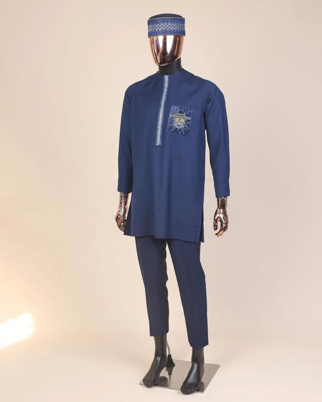A Navy blue, vexing demagogue pocket and flap embrodery, long sleeve African senator kaftan native.