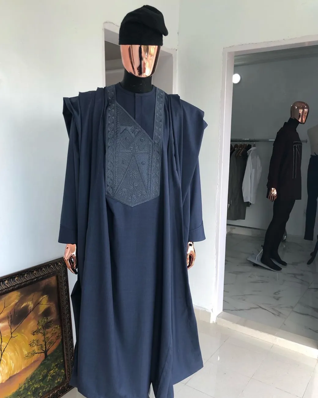 A Navy Blue with connected embroidery Agbada and Hand woven Yoruba Hat