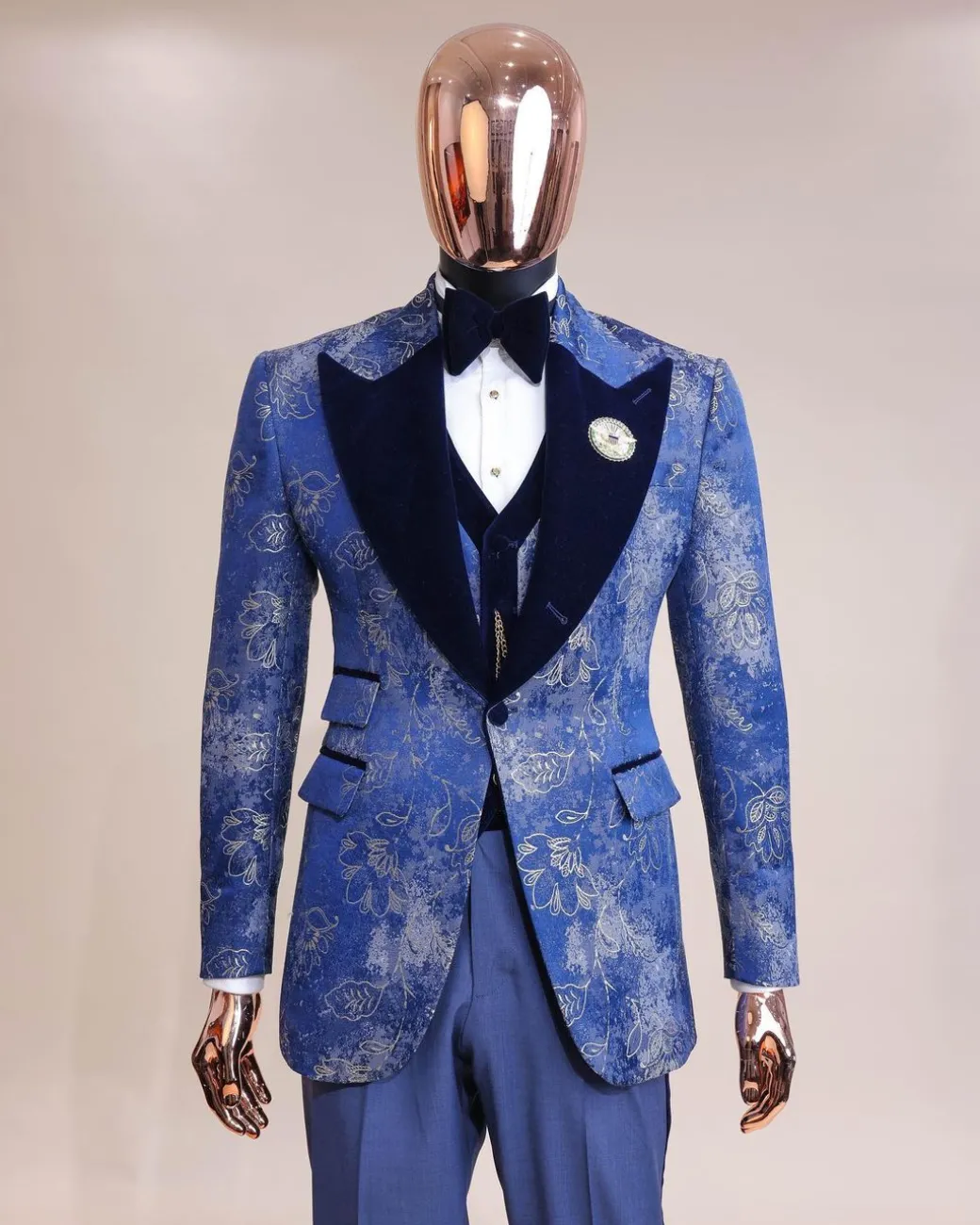 A peak lapel dispersed Sky blue and splashed champagne gold metallic jacquard tuxedo suit