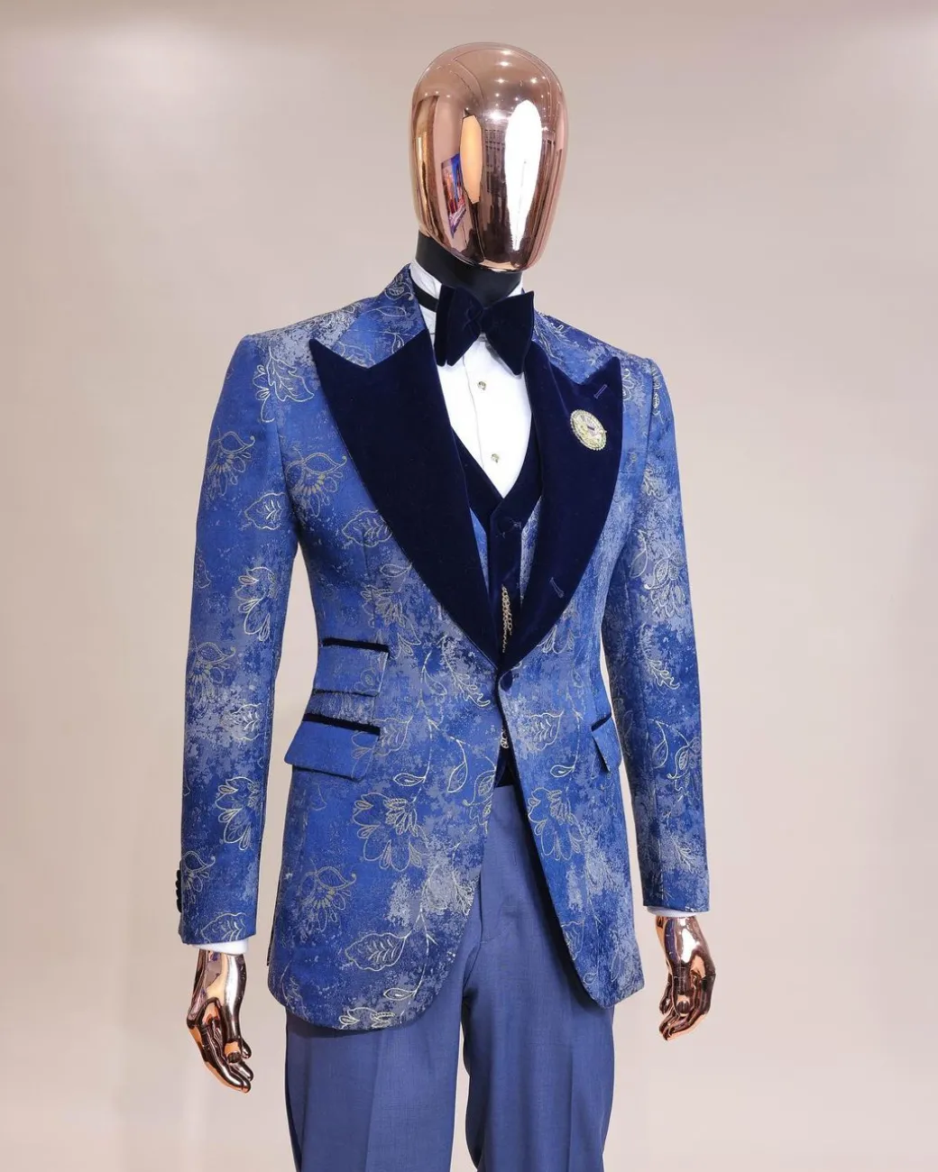 A peak lapel dispersed Sky blue and splashed champagne gold metallic jacquard tuxedo suit