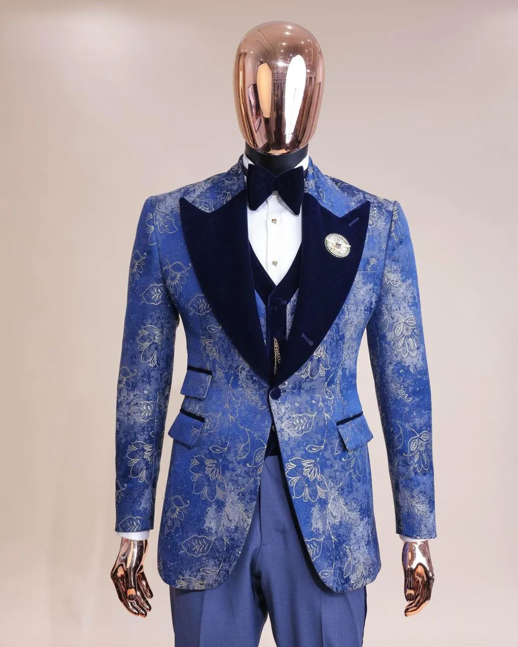 A peak lapel dispersed Sky blue and splashed champagne gold metallic jacquard tuxedo suit