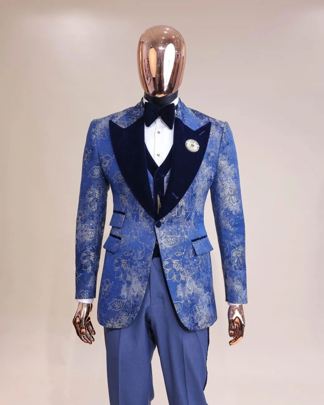 A peak lapel dispersed Sky blue and splashed champagne gold metallic jacquard tuxedo suit