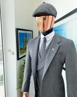 A “peaky blinders” Lava Grey, herringbone-patterned fabric, Jorgecarli Super 140’s “Board Room” notch lapel suit