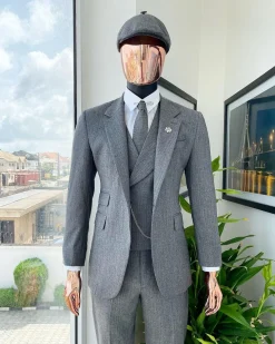 A “peaky blinders” Lava Grey, herringbone-patterned fabric, Jorgecarli Super 140’s “Board Room” notch lapel suit