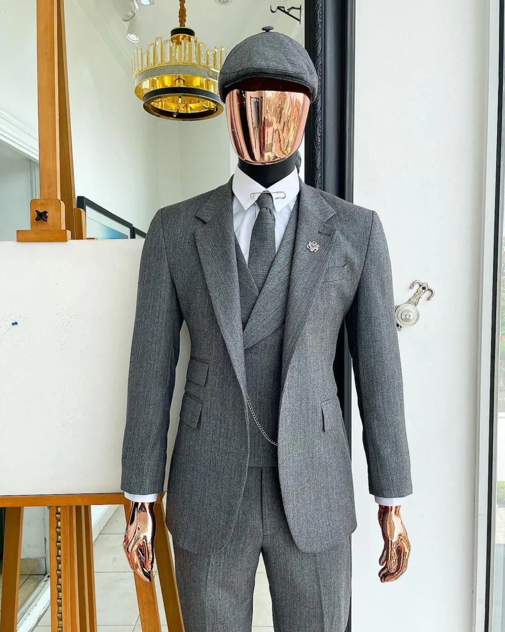 A “peaky blinders” Lava Grey, herringbone-patterned fabric, Jorgecarli Super 140’s “Board Room” notch lapel suit