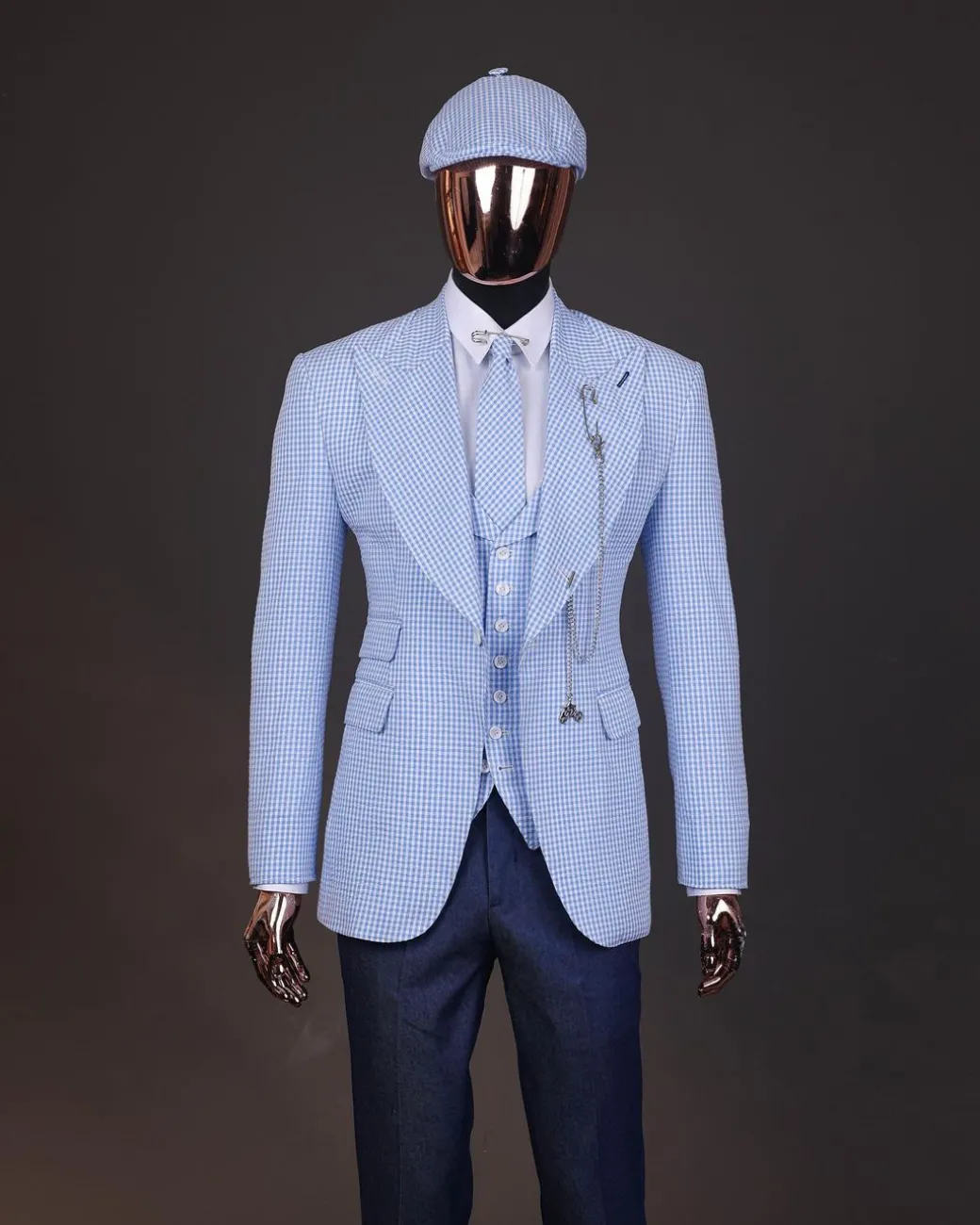 A “peaky blinders” skye blue and white check, seer sucker fabric, knitted, peak lapel suit