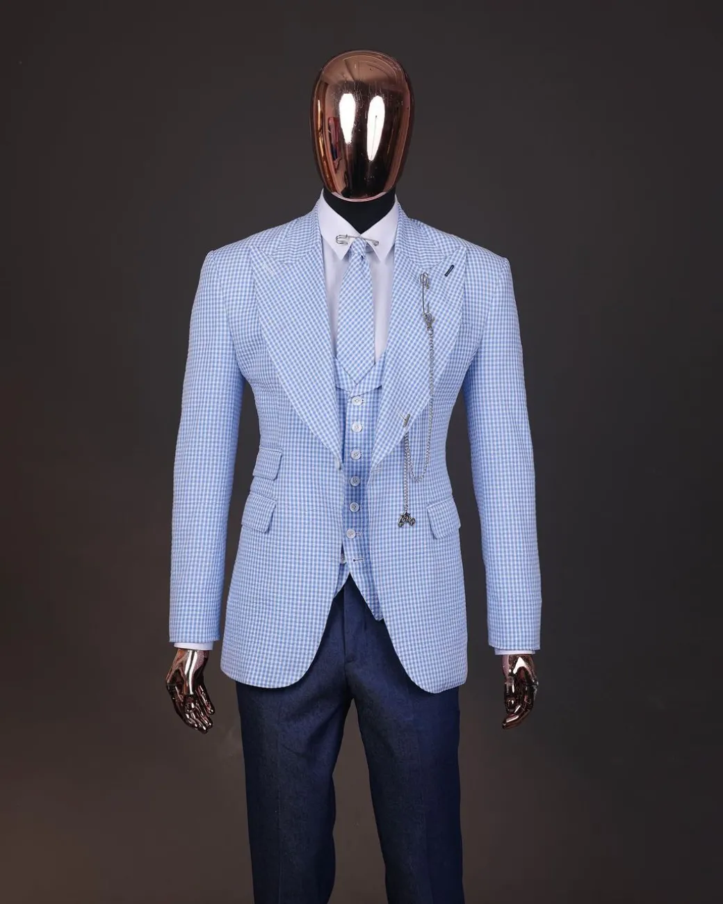 A “peaky blinders” skye blue and white check, seer sucker fabric, knitted, peak lapel suit