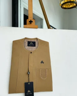 A Peanut Brown, embroidery patch pocket, vertical flap with Swarovski button detailing African traditional senator kaftan native.