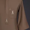 A Peanut brown, front flap, walking paul embroidery details, 3/4 sleeve African senator kaftan native.