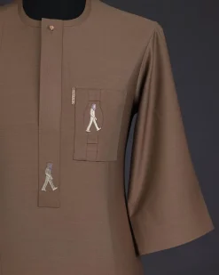 A Peanut brown, front flap, walking paul embroidery details, 3/4 sleeve African senator kaftan native.