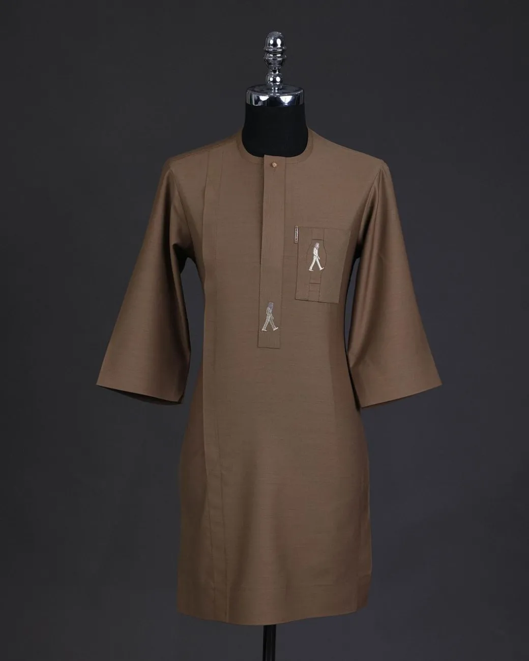 A Peanut brown, front flap, walking paul embroidery details, 3/4 sleeve African senator kaftan native.