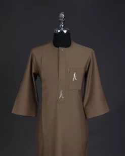 A Peanut brown, front flap, walking paul embroidery details, 3/4 sleeve African senator kaftan native.