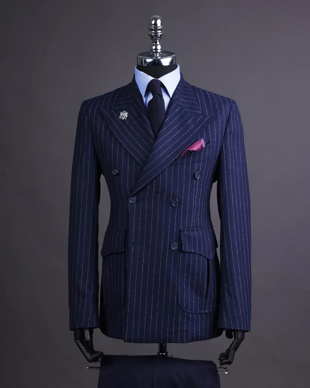 A Pencil stripe and navy blue – Jorgecarli – peak lapel double breasted suit