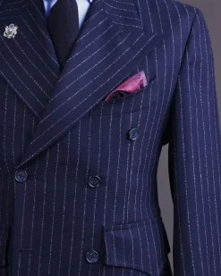 A Pencil stripe and navy blue – Jorgecarli – peak lapel double breasted suit