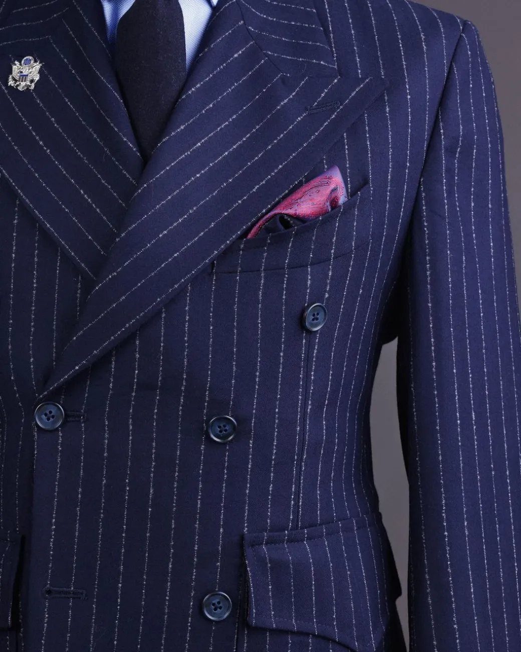 A Pencil stripe and navy blue – Jorgecarli – peak lapel double breasted suit