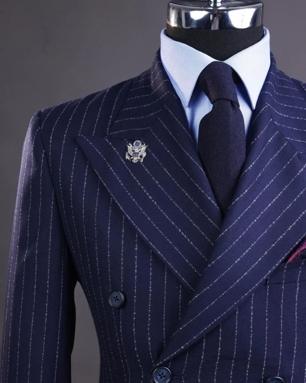 A Pencil stripe and navy blue – Jorgecarli – peak lapel double breasted suit