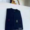 A pencil stripe midnight blue owl eye, double pocket, front flap African traditional senator kaftan native.