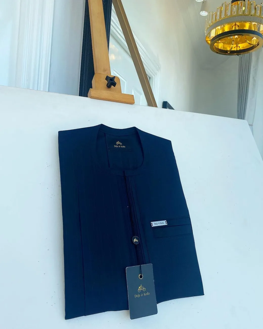 A pencil stripe midnight blue, lanes pocket, lanes front flap African traditional senator kaftan native.