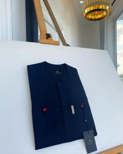 A pencil stripe midnight blue owl eye, double pocket, front flap African traditional senator kaftan native.
