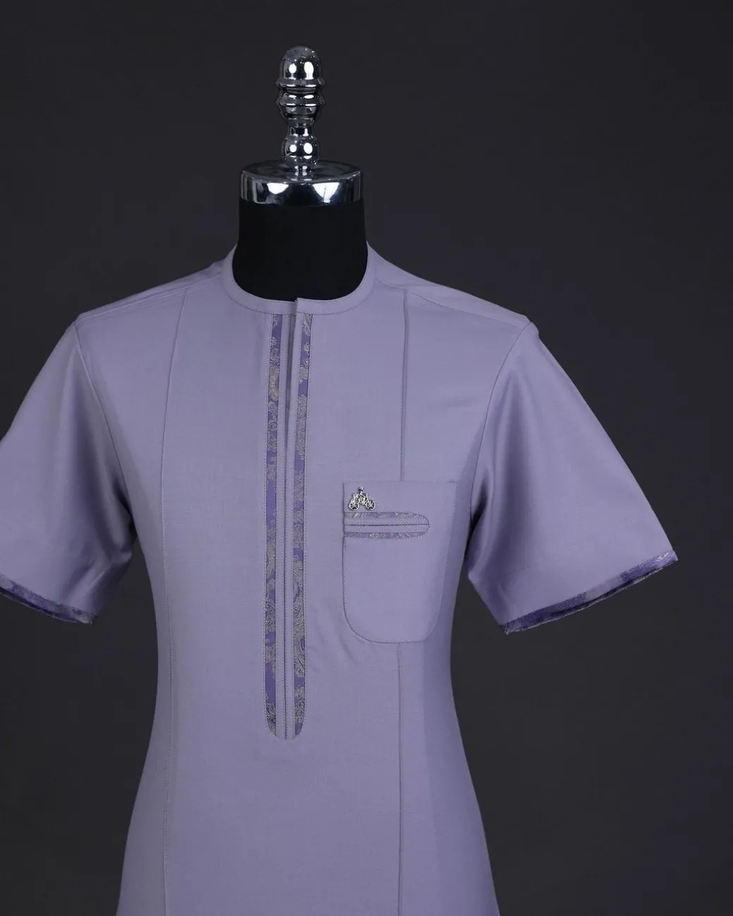 A periwinkle purple, zip line, paisley details, short sleeve African senator kaftan native.