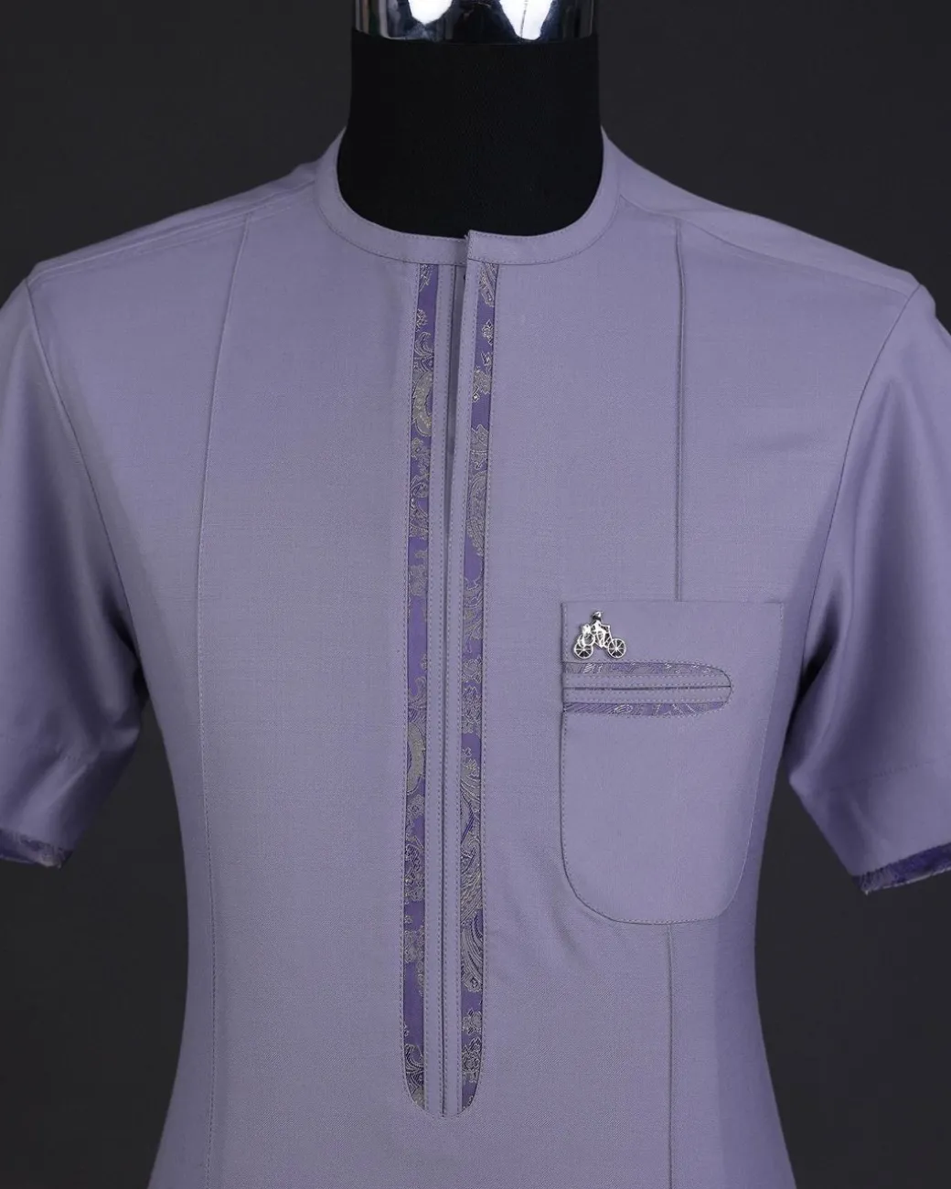 A periwinkle purple, zip line, paisley details, short sleeve African senator kaftan native.