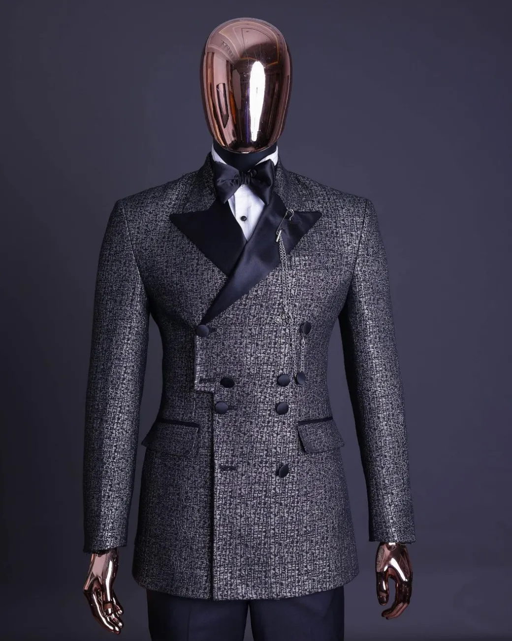 A “pirate” metallic jacquard, layered double breasted, 10 buttons, peak lapel tuxedo suit