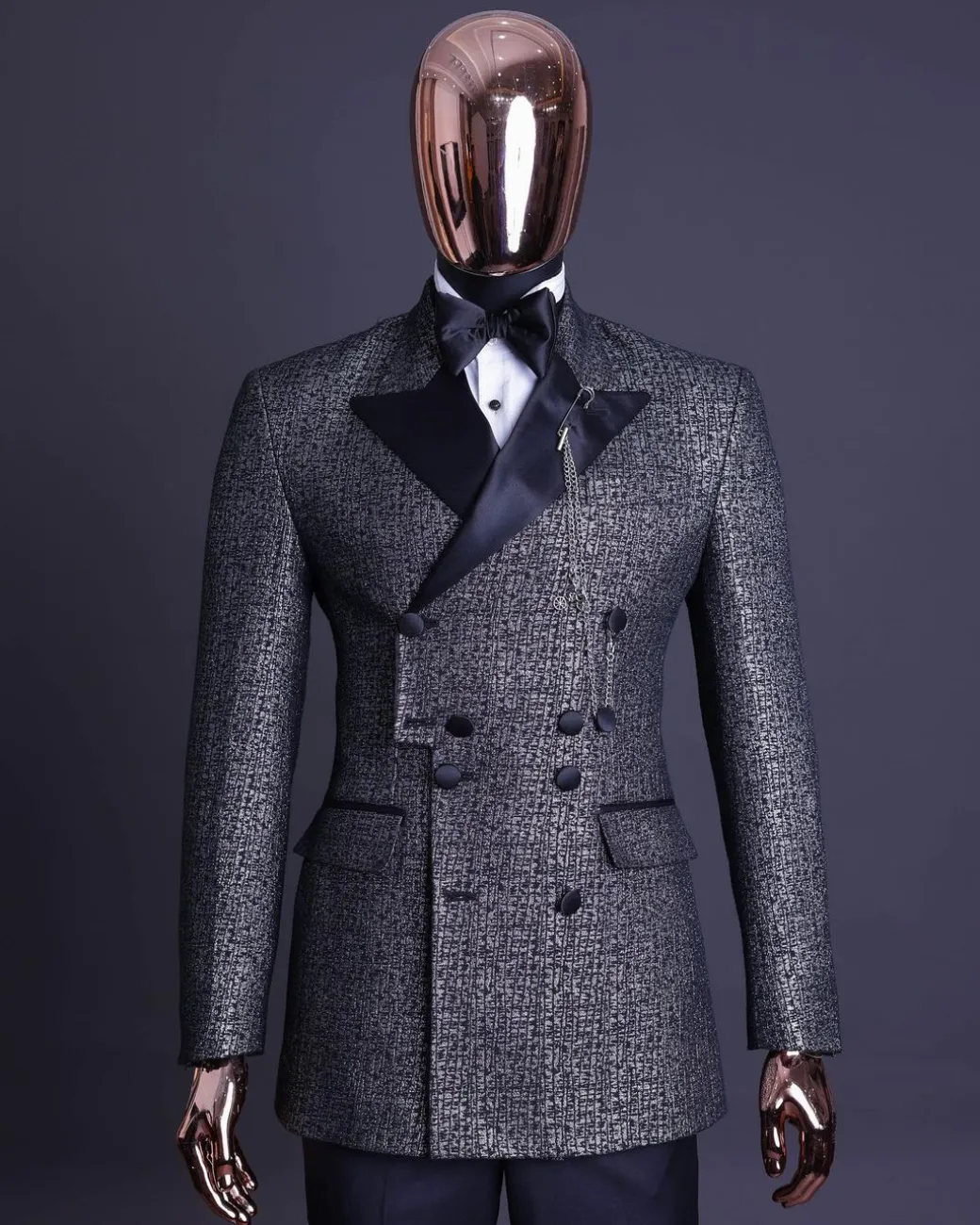A “pirate” metallic jacquard, layered double breasted, 10 buttons, peak lapel tuxedo suit