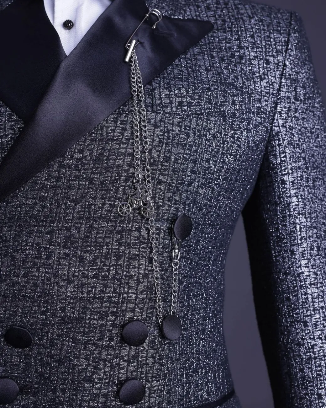 A “pirate” metallic jacquard, layered double breasted, 10 buttons, peak lapel tuxedo suit