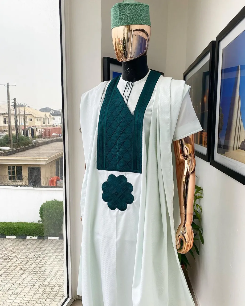 A pistachio green, connected inverted square ping green embroidery design agbada