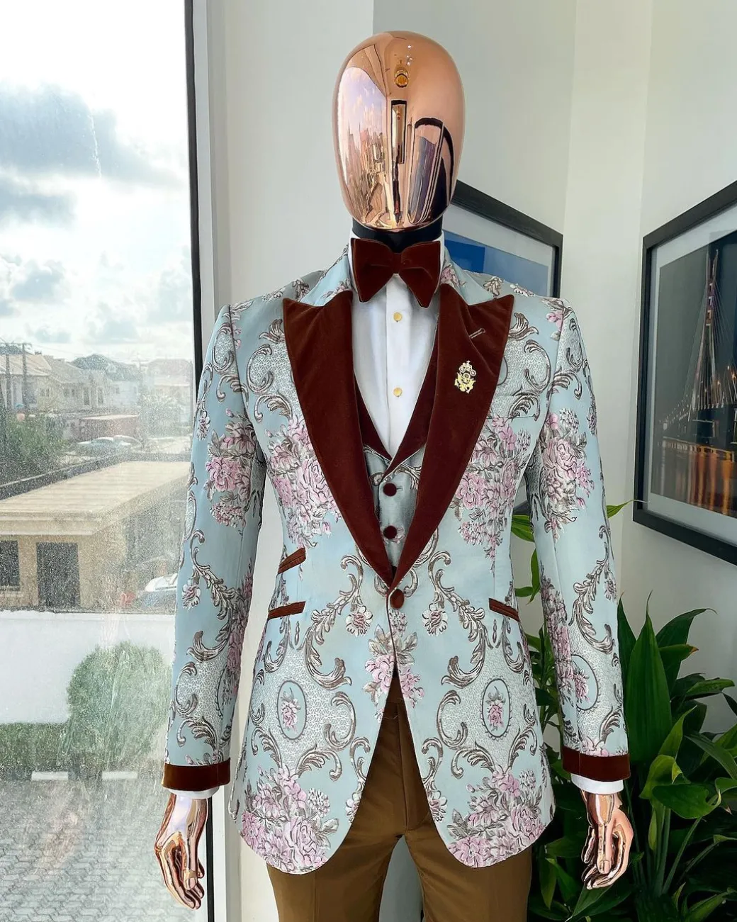 A pistachio green, pink and brown floral metallic jacquard tuxedo suit