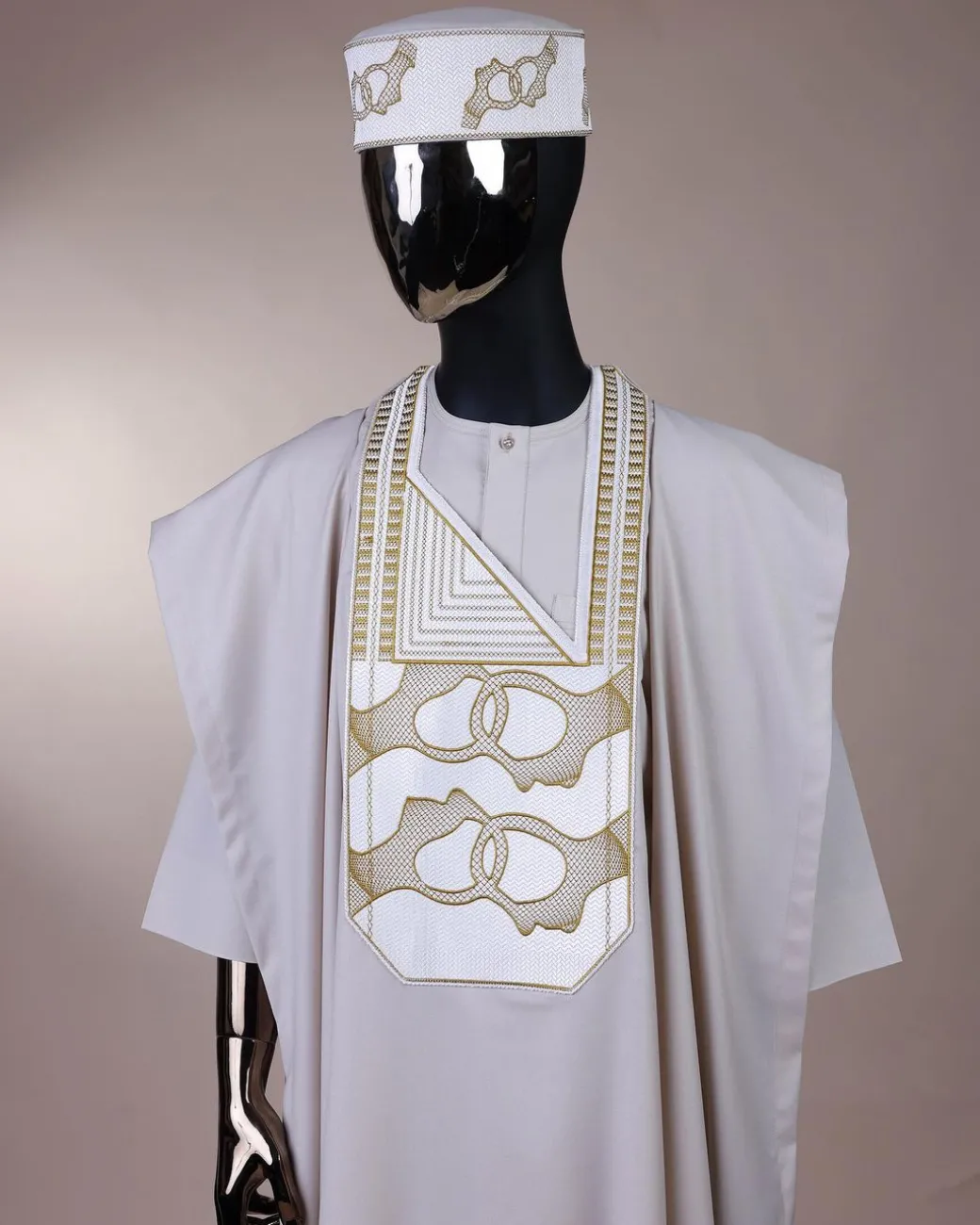 A porcelain, connected medulla and wooven pattern embroidery detailing agbada