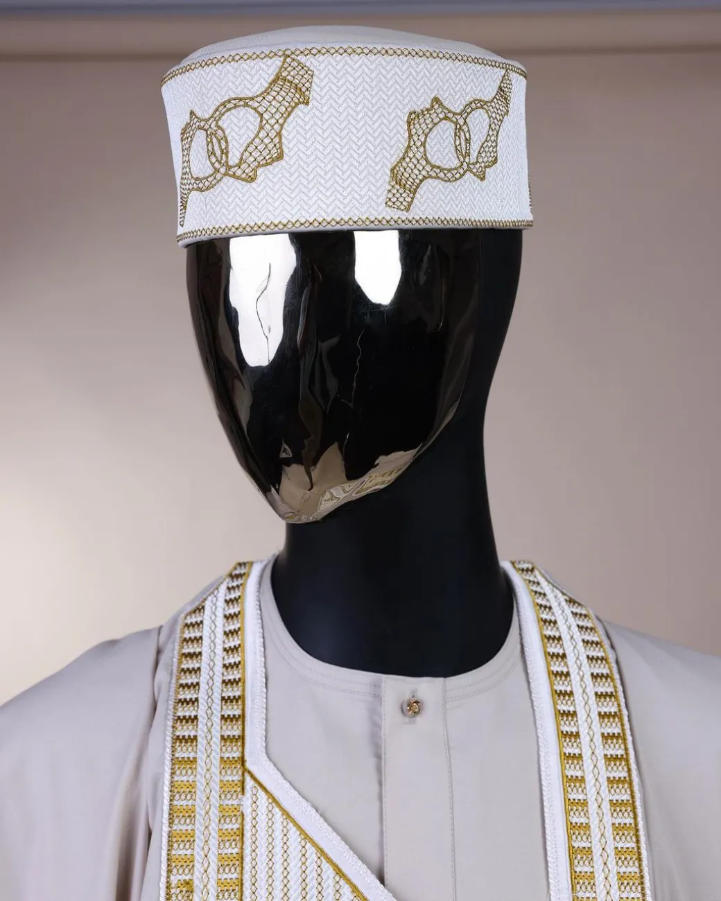 A porcelain, connected medulla and wooven pattern embroidery detailing agbada