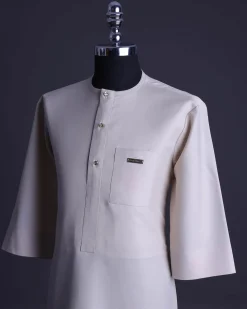 A Porcelain, front flap with gold Swarovski button, patch pocket, 3/4 sleeve African senator kaftan native.
