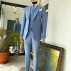 A powdered blue ”peaky blinders” peak lapel business suit