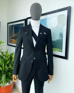 A “power” front and back slit charcoal black, long cross strap peak lapel suit