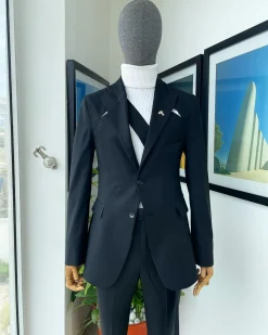 A “power” front and back slit charcoal black, long cross strap peak lapel suit